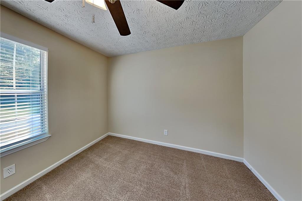 1049 Braddock Circle Woodstock, GA 30189 - Photo 16 of 20 a view of a room with window and white walls