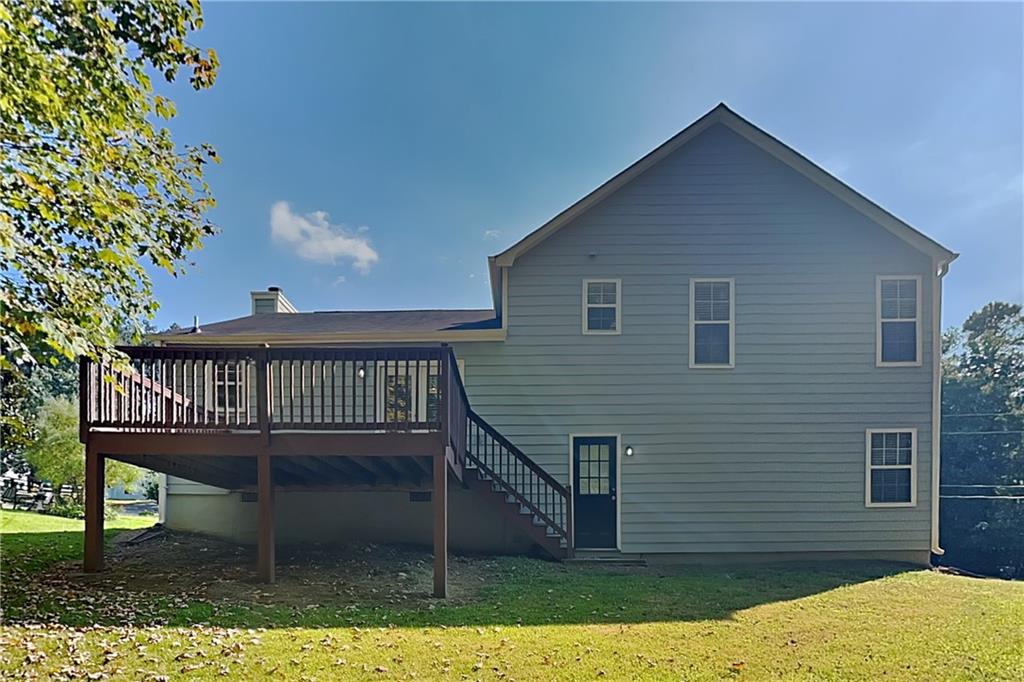 1049 Braddock Circle Woodstock, GA 30189 - Photo 18 of 20 a view of a house with a deck