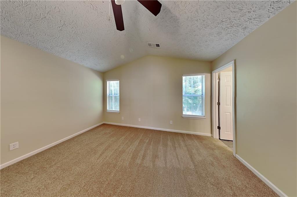 1049 Braddock Circle Woodstock, GA 30189 - Photo 8 of 20 an empty room with windows