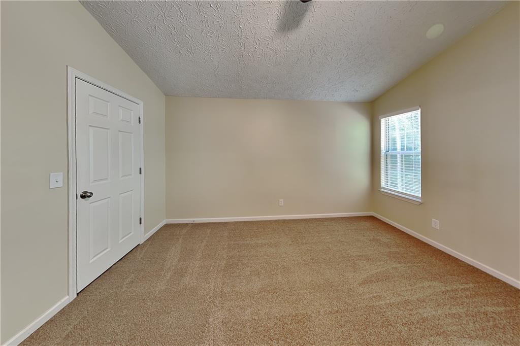 1049 Braddock Circle Woodstock, GA 30189 - Photo 9 of 20 a view of an empty room with a window