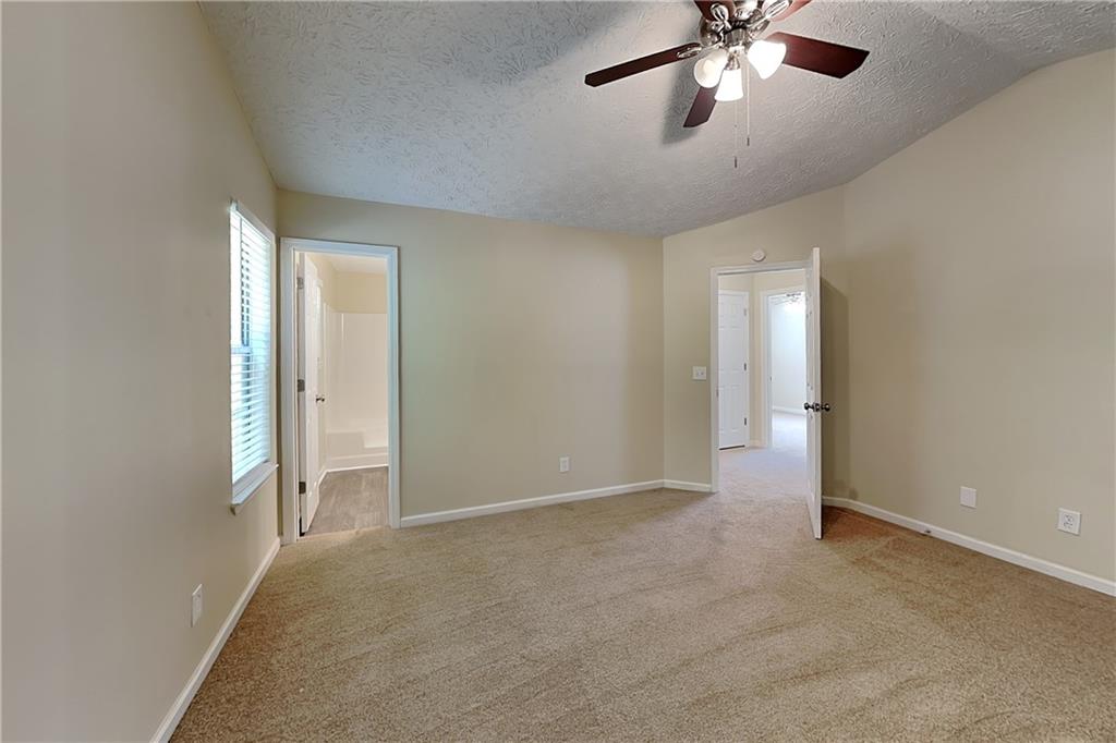 1049 Braddock Circle Woodstock, GA 30189 - Photo 10 of 20 a view of an empty room and chandelier fan