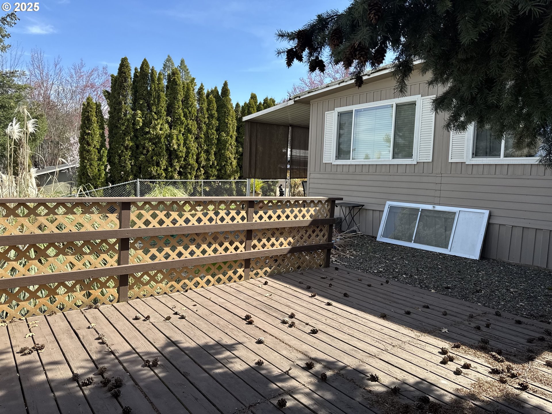 3955 South Stage Road, Unit 6 Medford, OR 97501 - Photo 18 of 21 a view of a house with a bench
