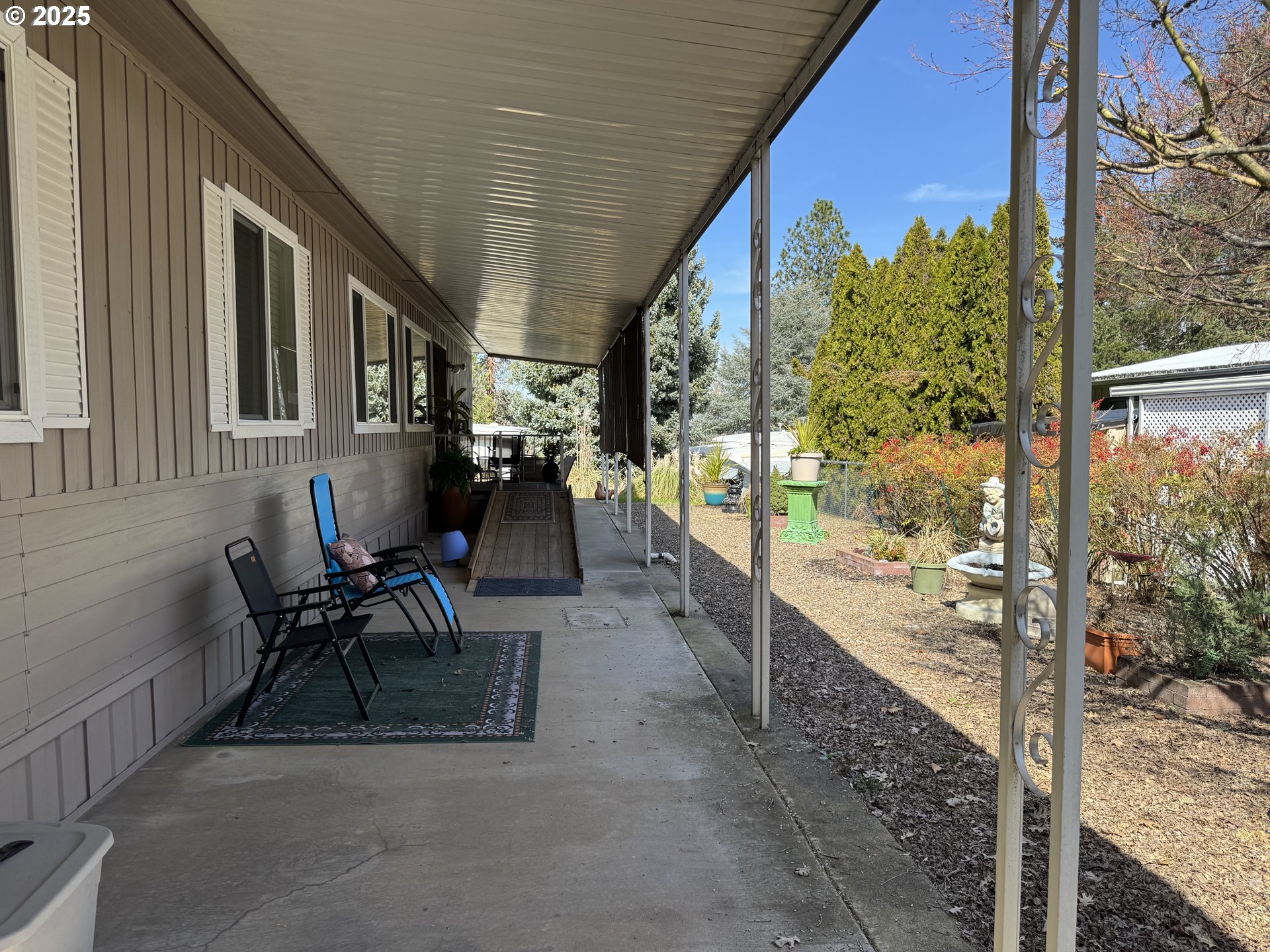 3955 South Stage Road, Unit 6 Medford, OR 97501 - Photo 2 of 21 a view of a porch with furniture and a yard