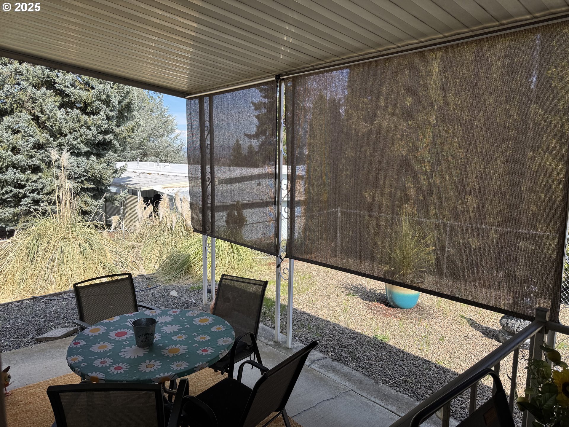 3955 South Stage Road, Unit 6 Medford, OR 97501 - Photo 21 of 21 a outdoor dining space with furniture and umbrella