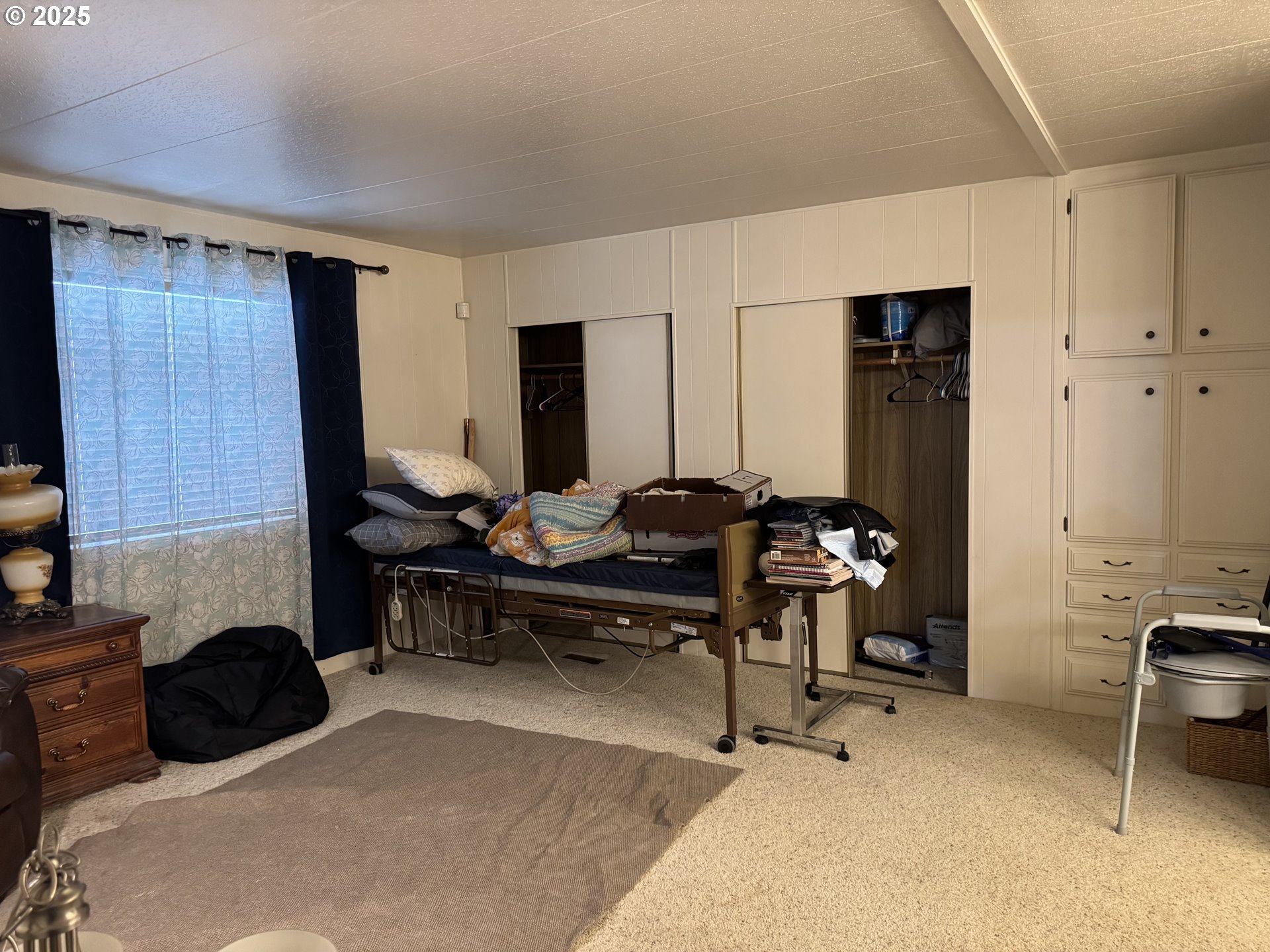 3955 South Stage Road, Unit 6 Medford, OR 97501 - Photo 8 of 21 a living room with furniture a flat screen tv and a window