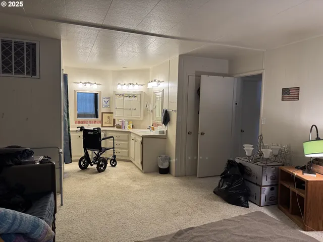 a bedroom with a bed a desk and chair