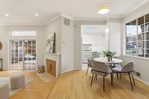 a view of a livingroom with furniture and a window