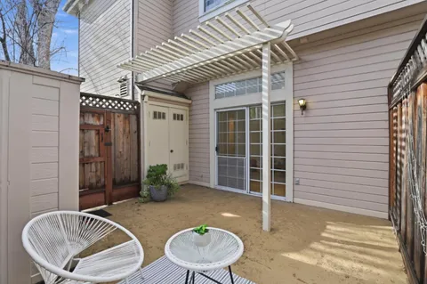 a backyard of a house with seating space