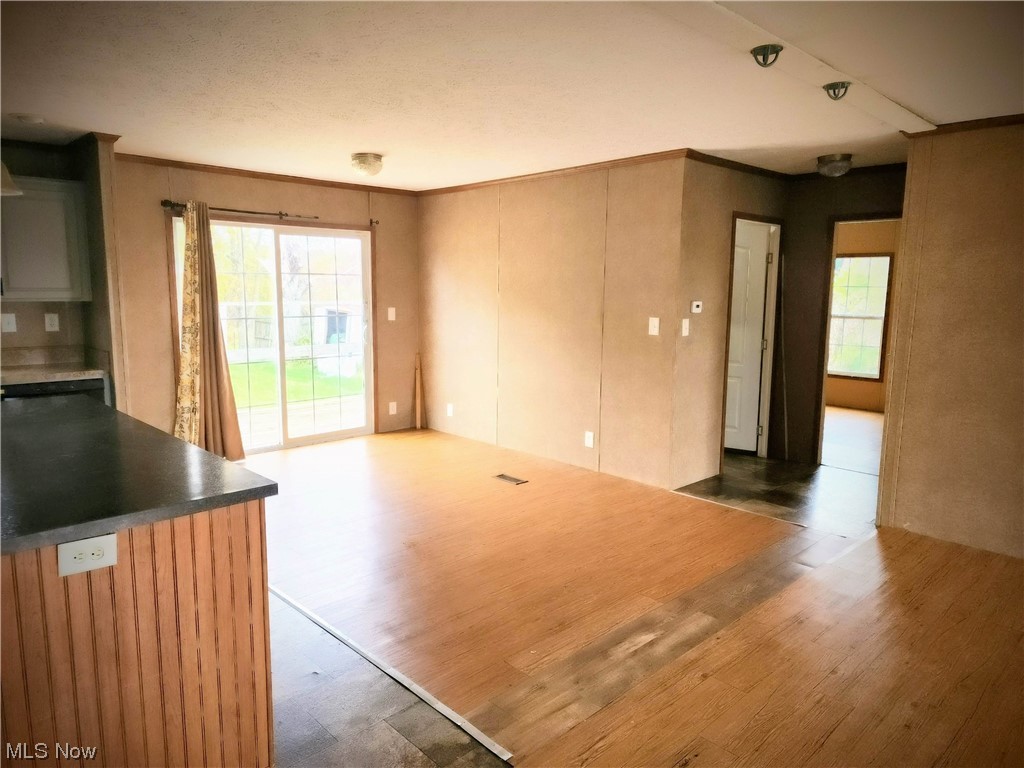 2925 Barth Road Belpre, OH 45714 - Photo 13 of 19 Unfurnished dining room with light wood-type flooring