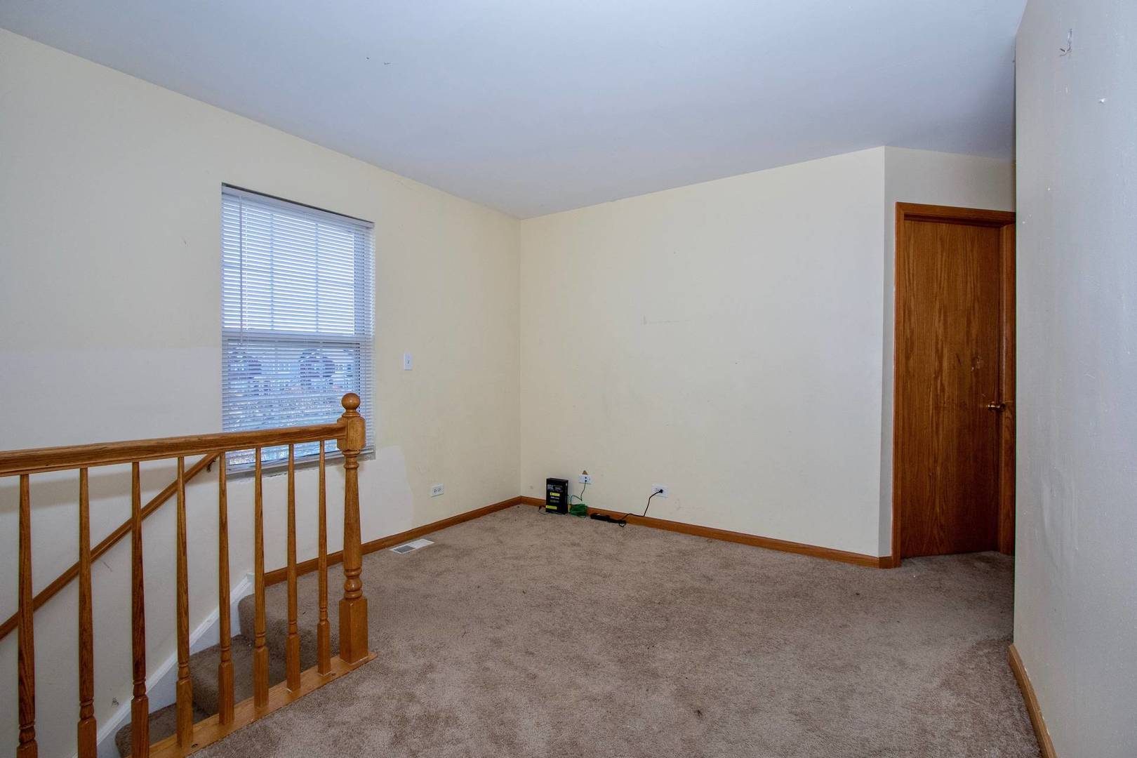 175 Springbrook Trail South Oswego, IL 60543 - Photo 15 of 25 a view of an empty room with wooden floor