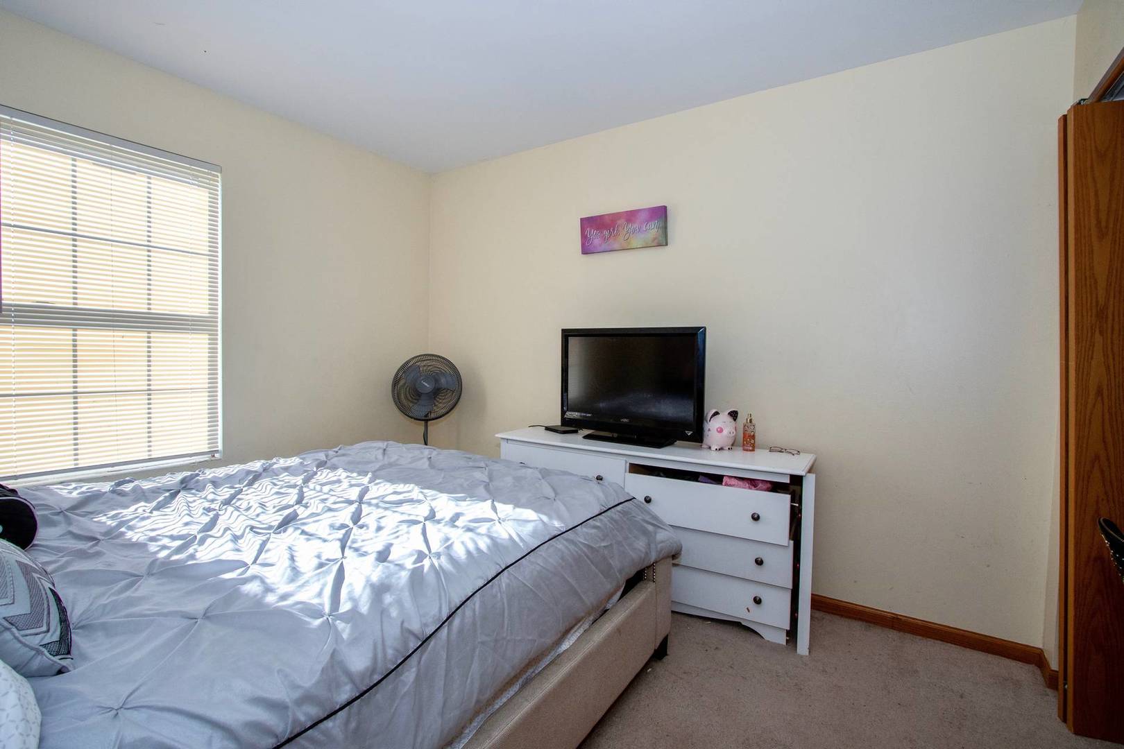 175 Springbrook Trail South Oswego, IL 60543 - Photo 16 of 25 a bedroom with a bed and a flat screen tv