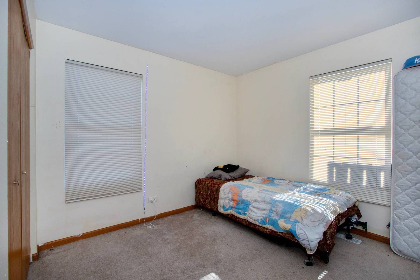175 Springbrook Trail South Oswego, IL 60543 - Photo 18 of 25 a bedroom with a bed and a window