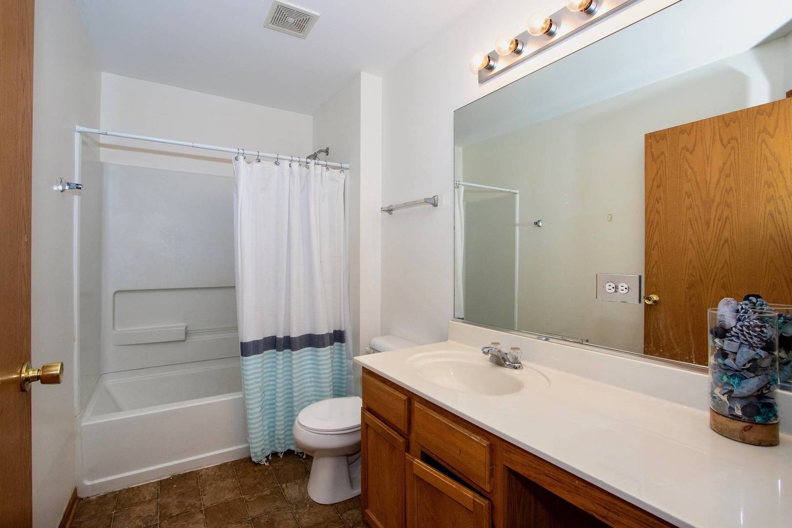 175 Springbrook Trail South Oswego, IL 60543 - Photo 20 of 25 a bathroom with a sink a toilet and shower