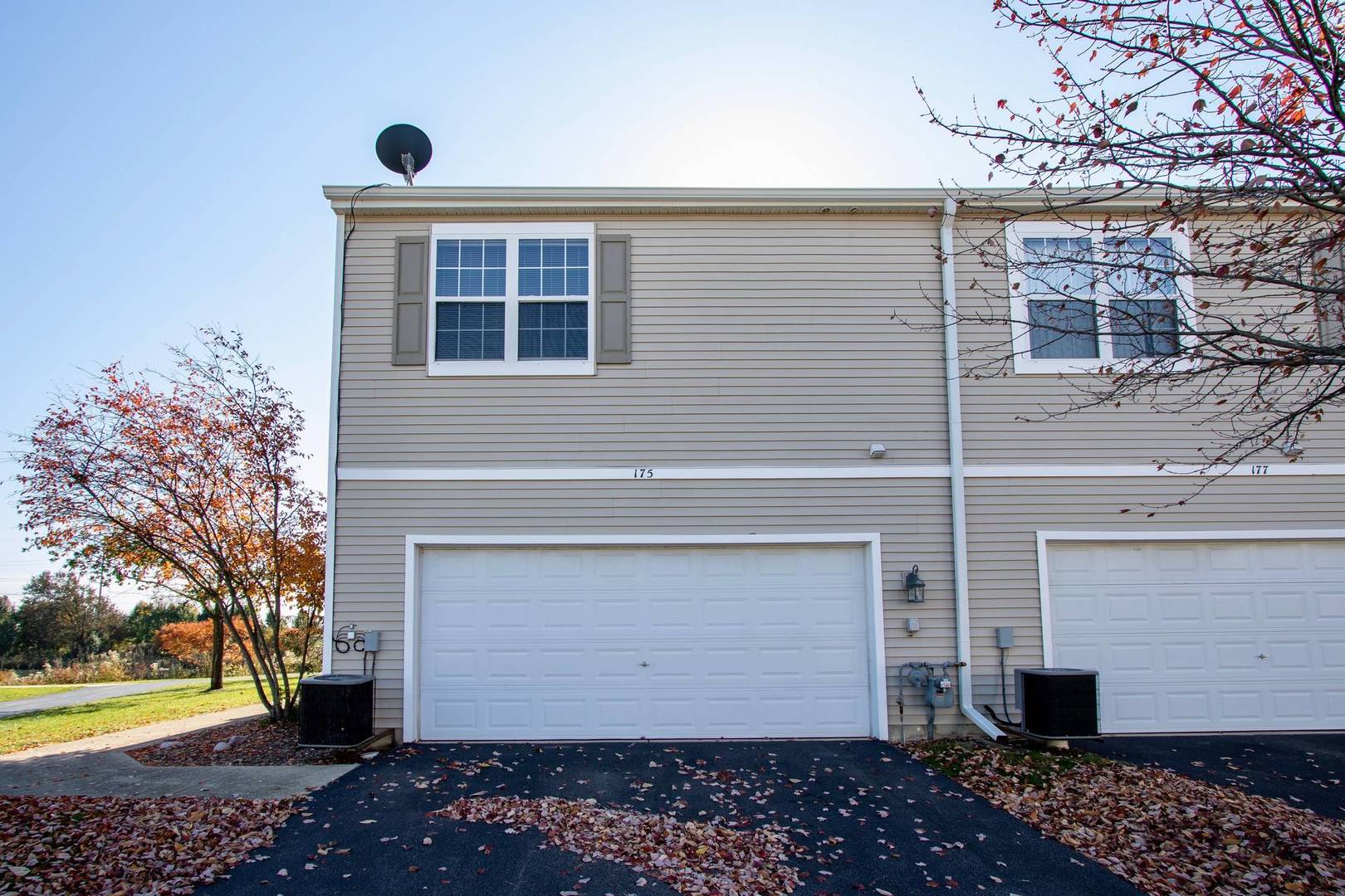 175 Springbrook Trail South Oswego, IL 60543 - Photo 22 of 25 a front view of a house with a yard