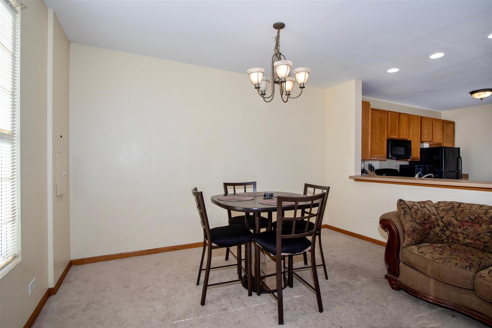 175 Springbrook Trail South Oswego, IL 60543 - Photo 6 of 25 a view of a dining room with furniture