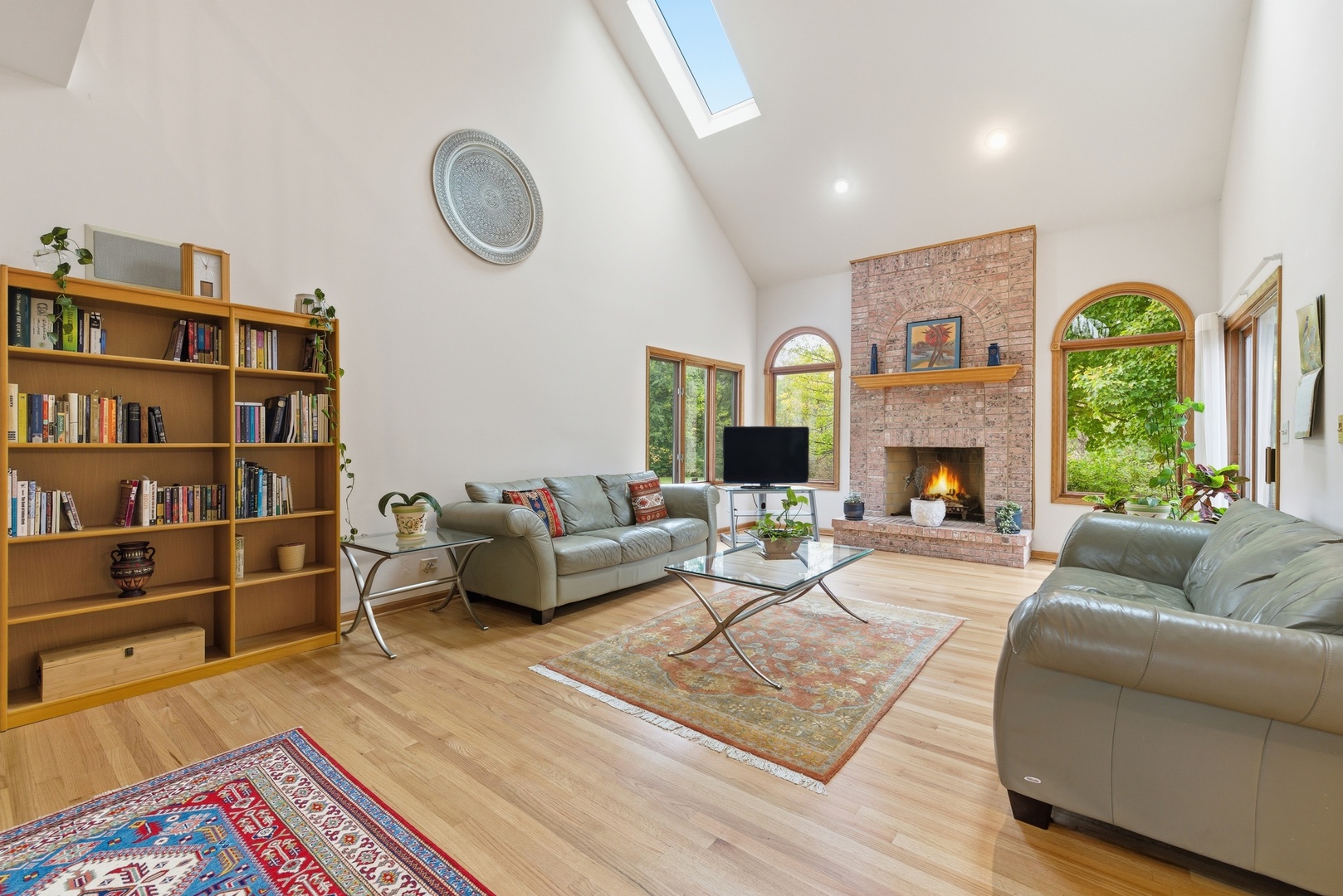 4420 Stonehaven Drive Long Grove, IL 60047 - Photo 11 of 59 a living room with furniture fireplace and a book shelf