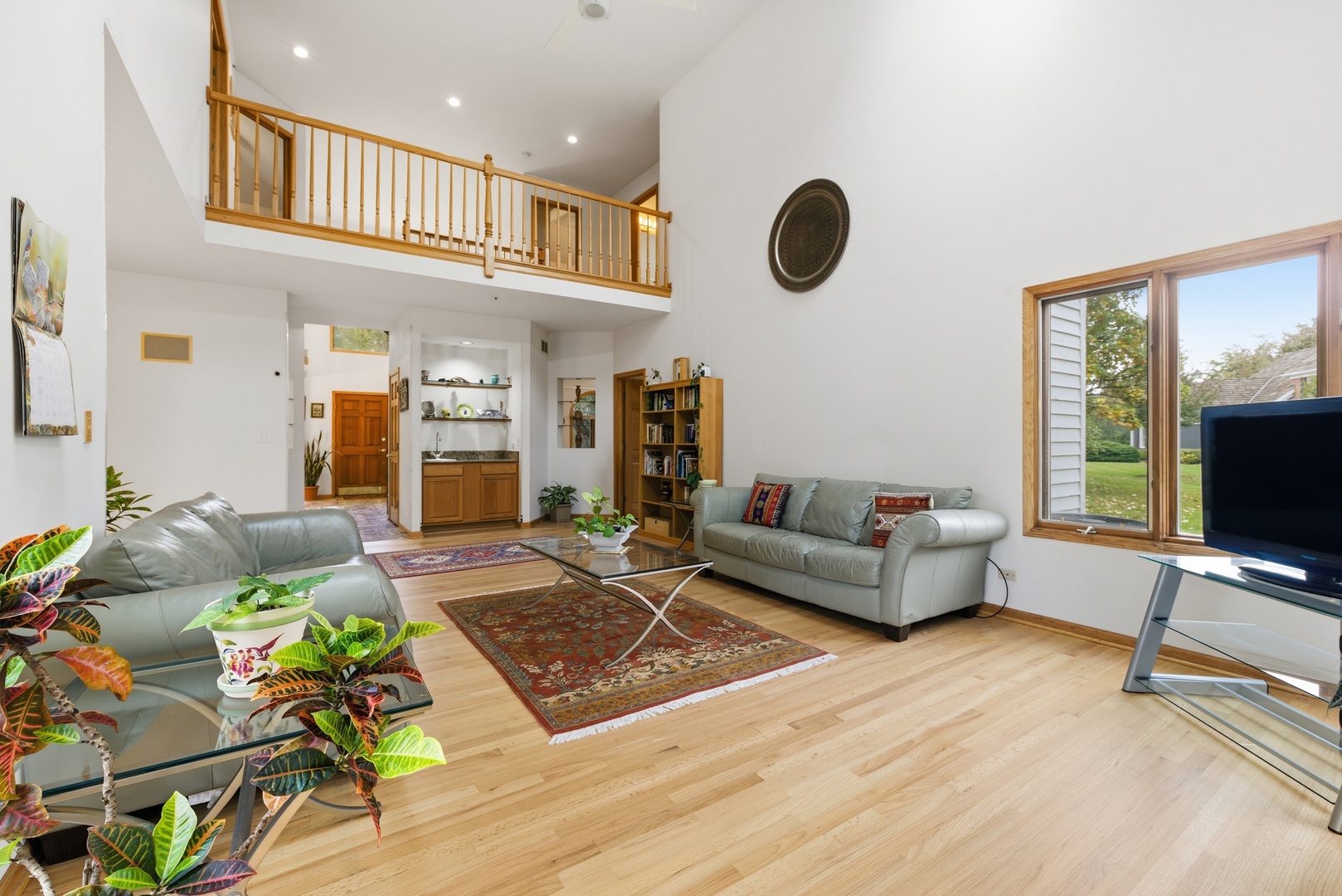 4420 Stonehaven Drive Long Grove, IL 60047 - Photo 12 of 59 a living room with furniture and a flat screen tv