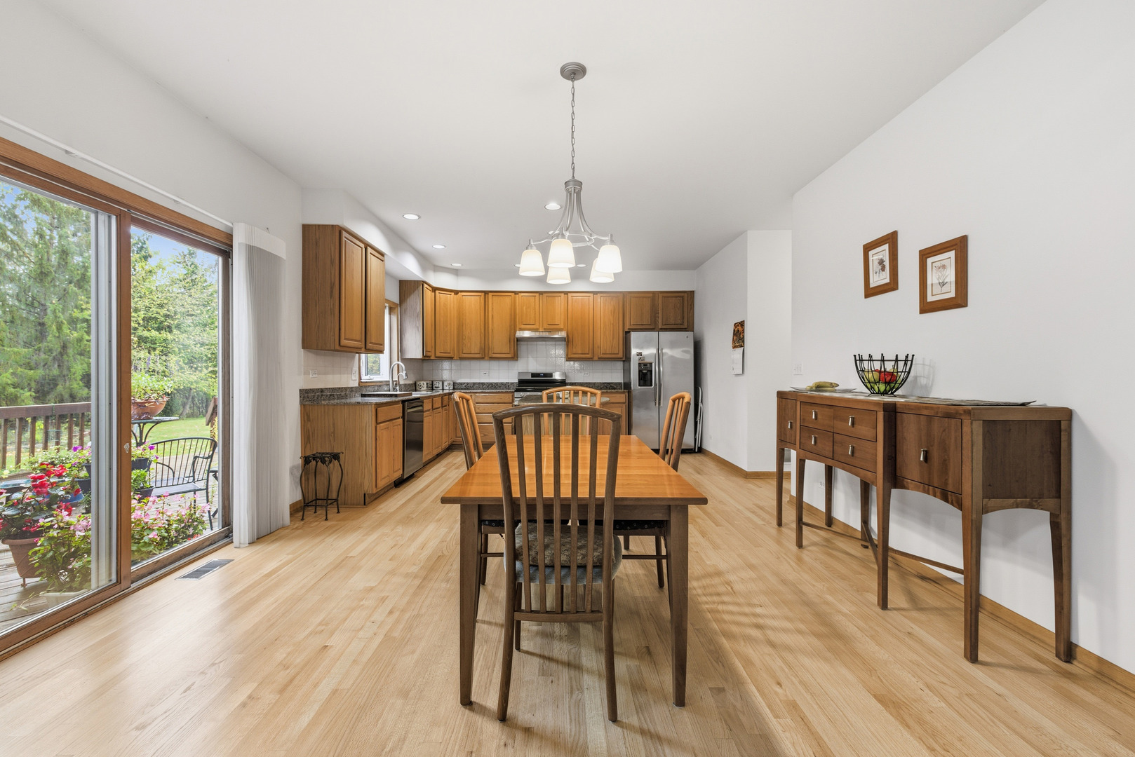 4420 Stonehaven Drive Long Grove, IL 60047 - Photo 14 of 59 a view of a dining room with furniture window and wooden floor