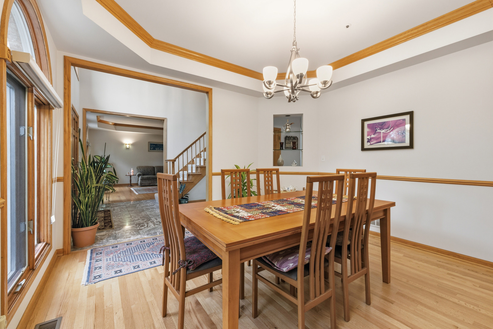 4420 Stonehaven Drive Long Grove, IL 60047 - Photo 25 of 59 a dining room with furniture a chandelier and wooden floor