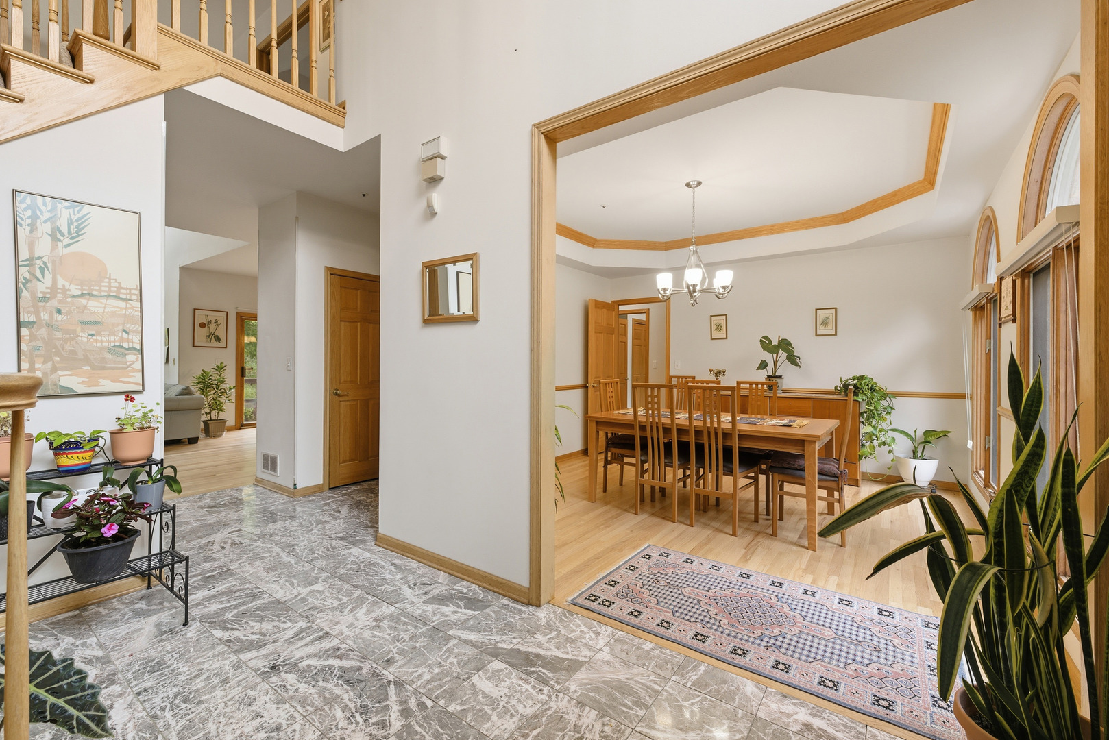 4420 Stonehaven Drive Long Grove, IL 60047 - Photo 28 of 59 a view of a livingroom with furniture and a dining table with wooden floor
