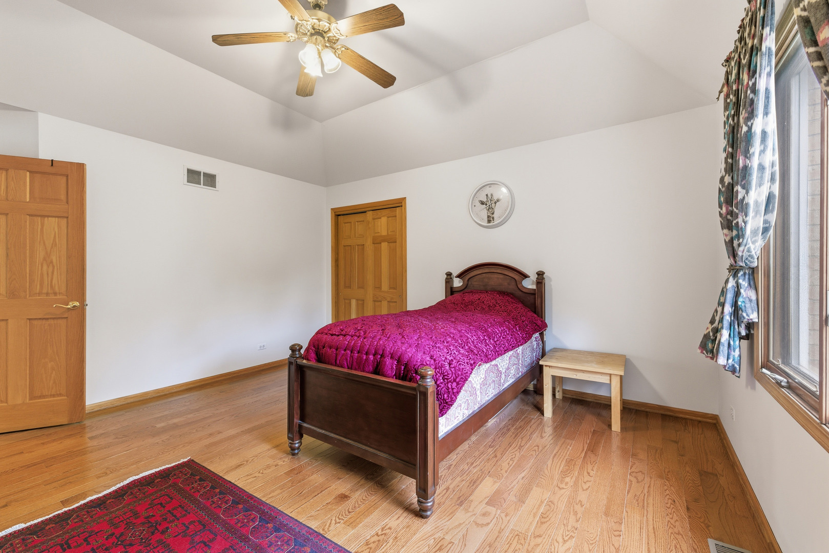 4420 Stonehaven Drive Long Grove, IL 60047 - Photo 38 of 59 a spacious bedroom with a bed and a chandelier