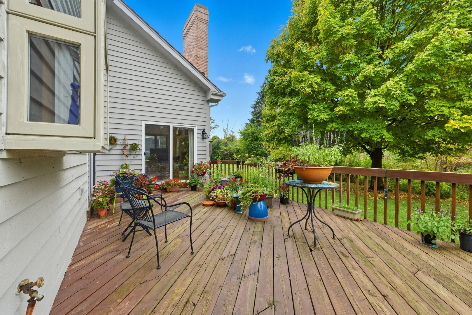 4420 Stonehaven Drive Long Grove, IL 60047 - Photo 48 of 59 a view of a house with wooden deck and furniture