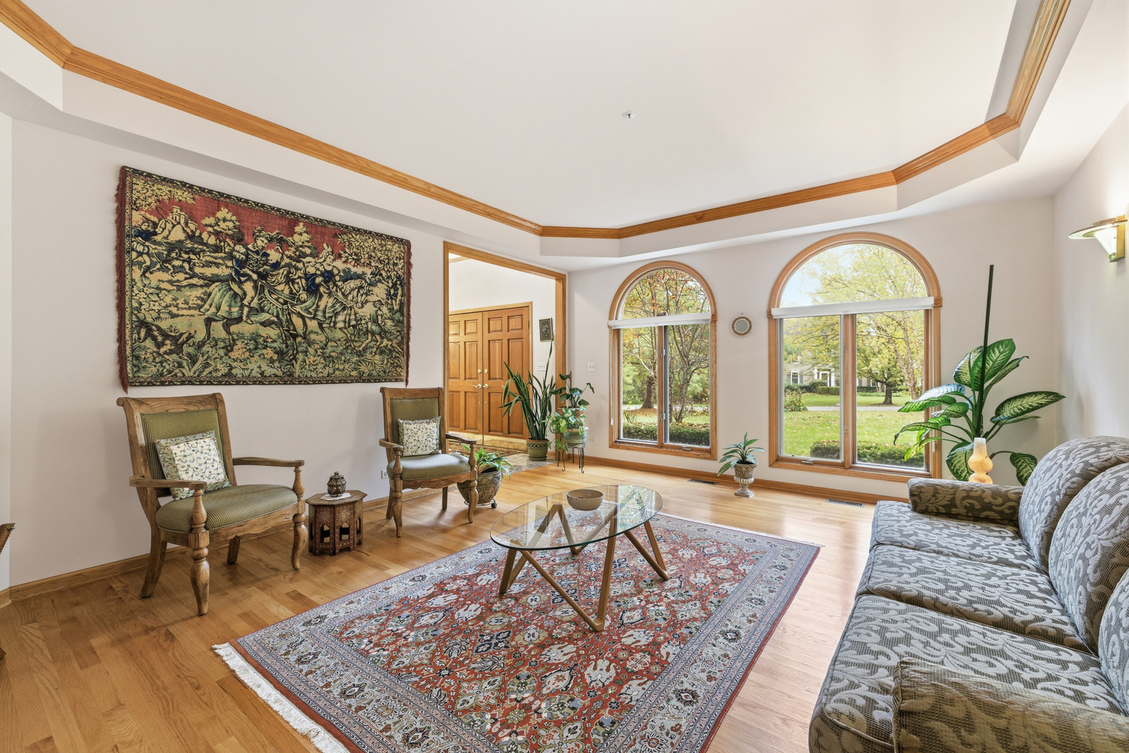 4420 Stonehaven Drive Long Grove, IL 60047 - Photo 5 of 59 a living room with a couch a table and a large window