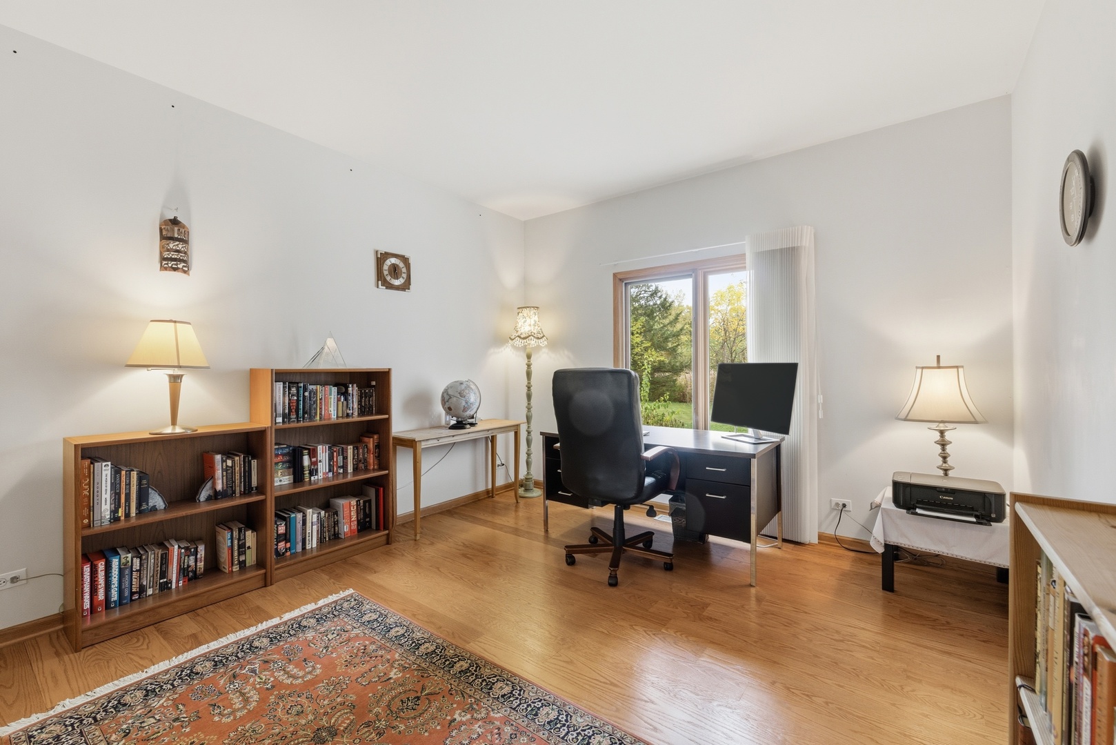 4420 Stonehaven Drive Long Grove, IL 60047 - Photo 9 of 59 a view of a livingroom with workspace and a bookshelf