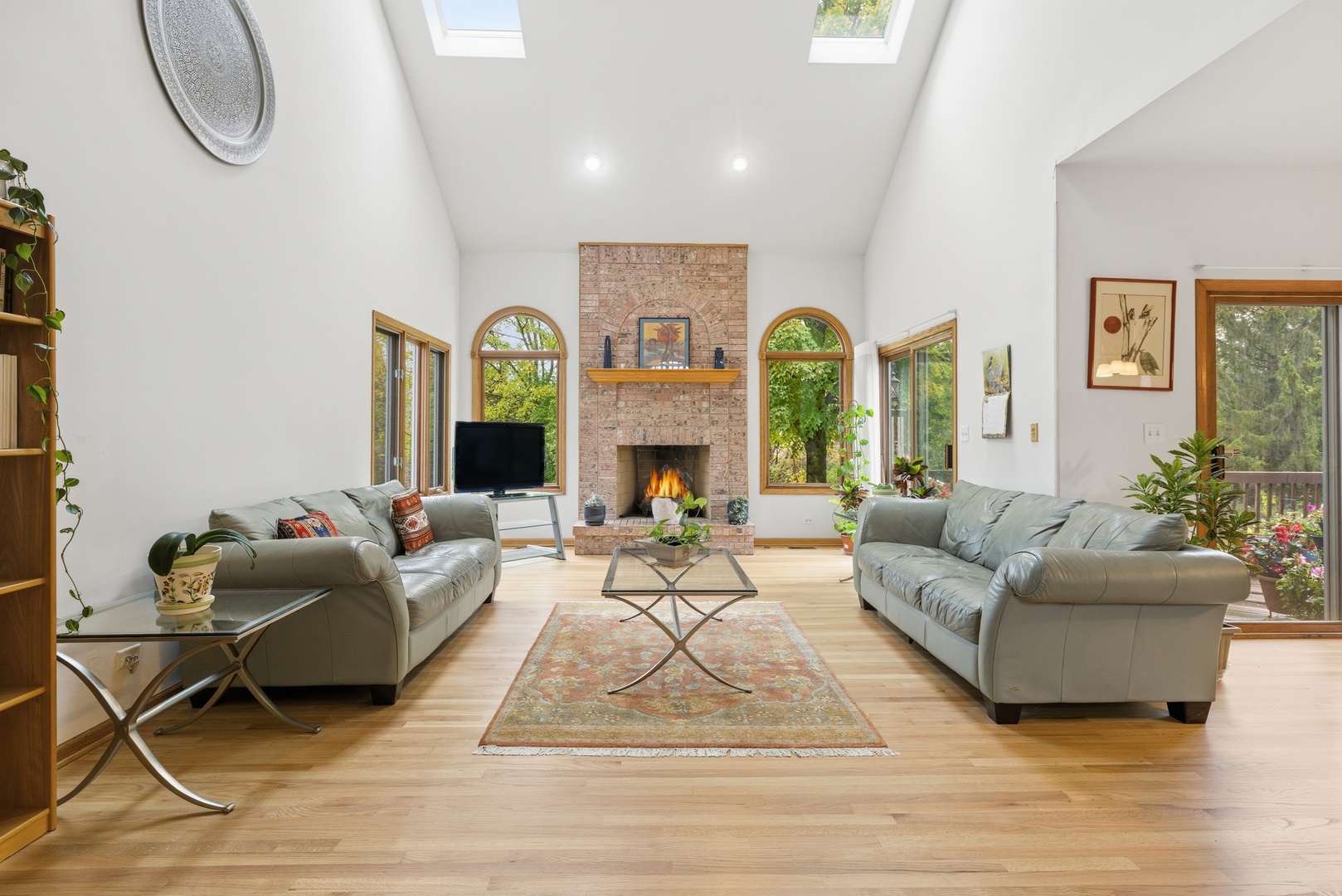 4420 Stonehaven Drive Long Grove, IL 60047 - Photo 10 of 59 a living room with furniture a fireplace and a large window