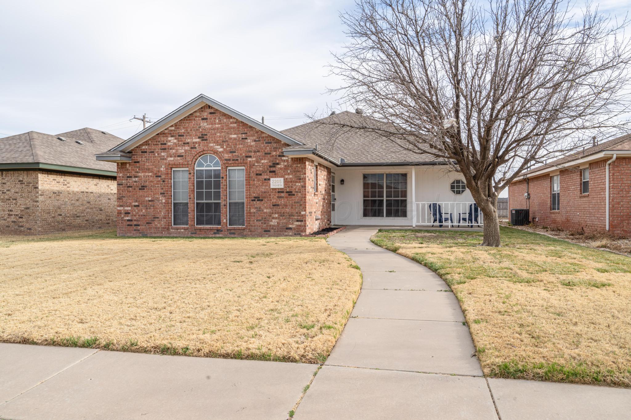 2205 Troveta Drive Amarillo, TX 79110 - Photo 1 of 28 a front view of house with yard