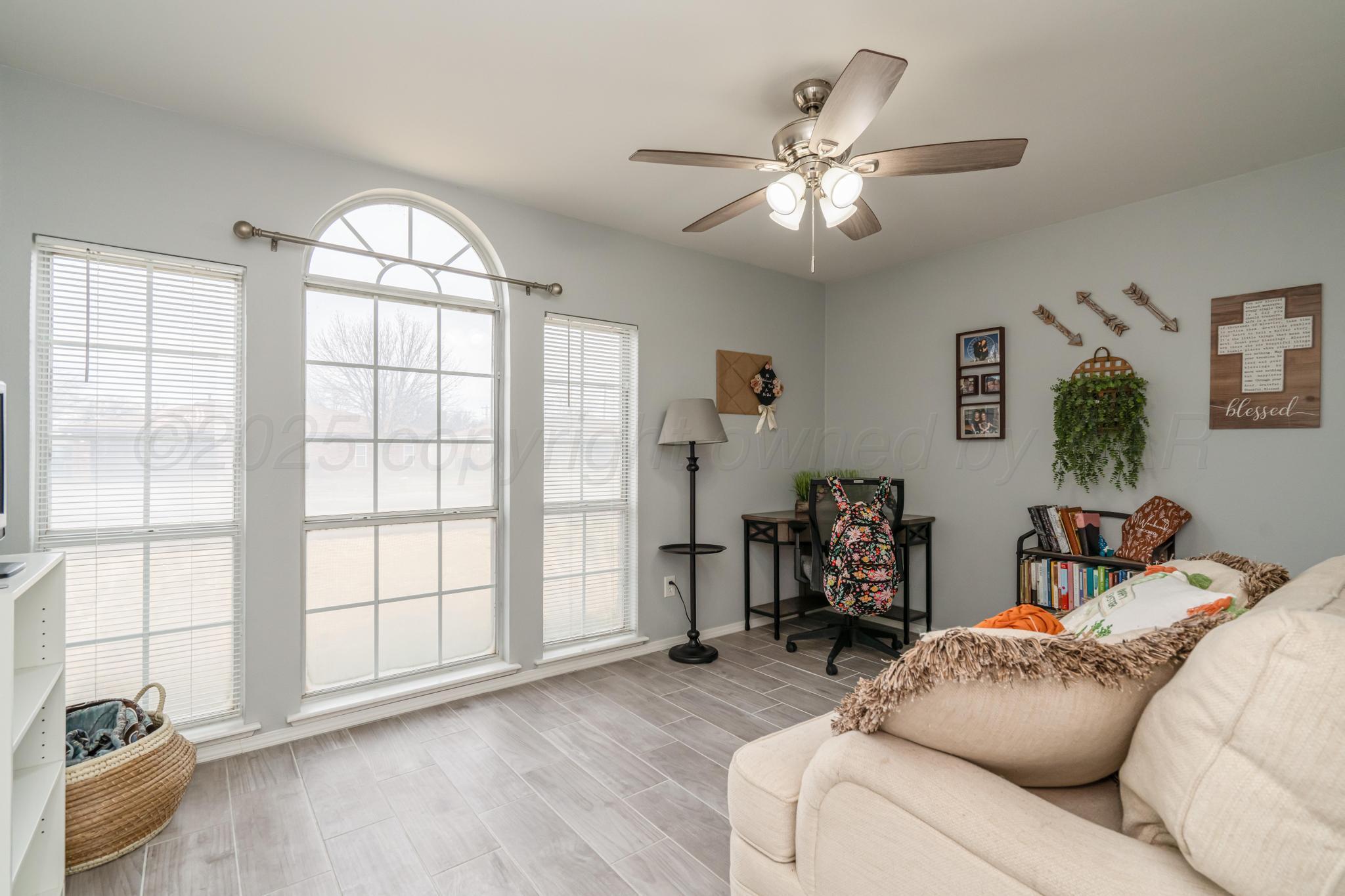 2205 Troveta Drive Amarillo, TX 79110 - Photo 18 of 28 a living room with furniture and a large window