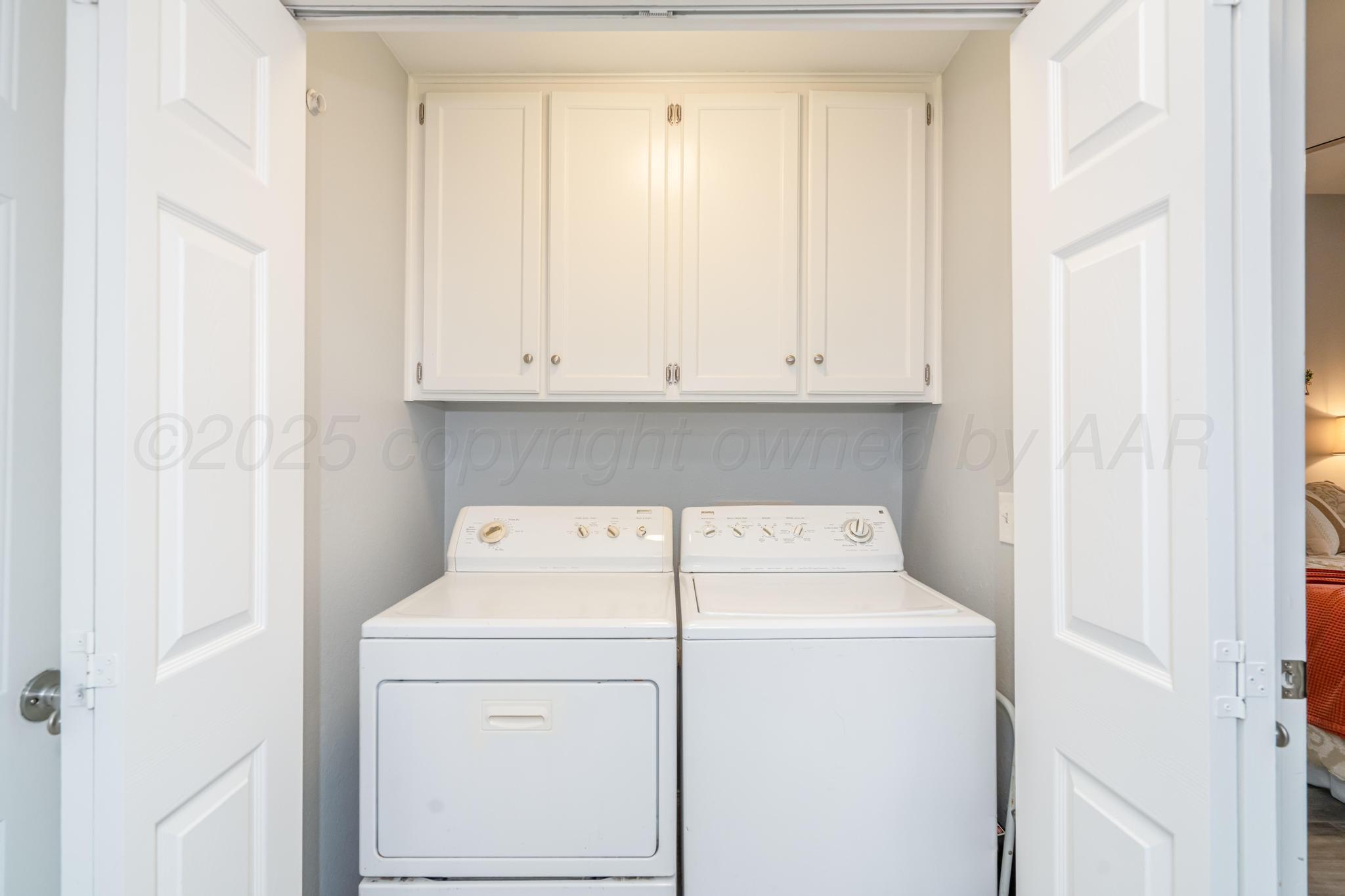 2205 Troveta Drive Amarillo, TX 79110 - Photo 21 of 28 a utility room with dryer and washer