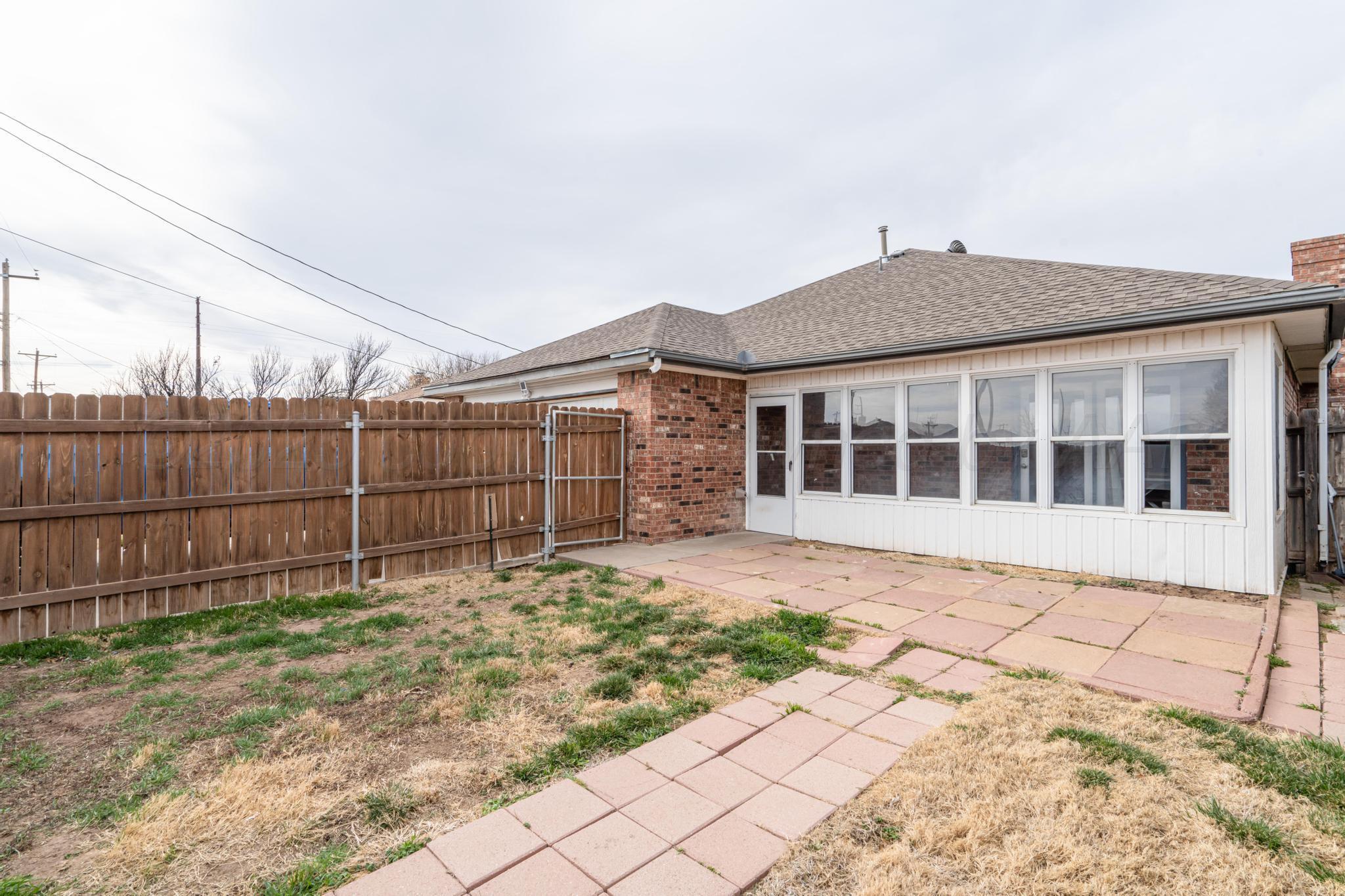 2205 Troveta Drive Amarillo, TX 79110 - Photo 25 of 28 a view of a house with a backyard