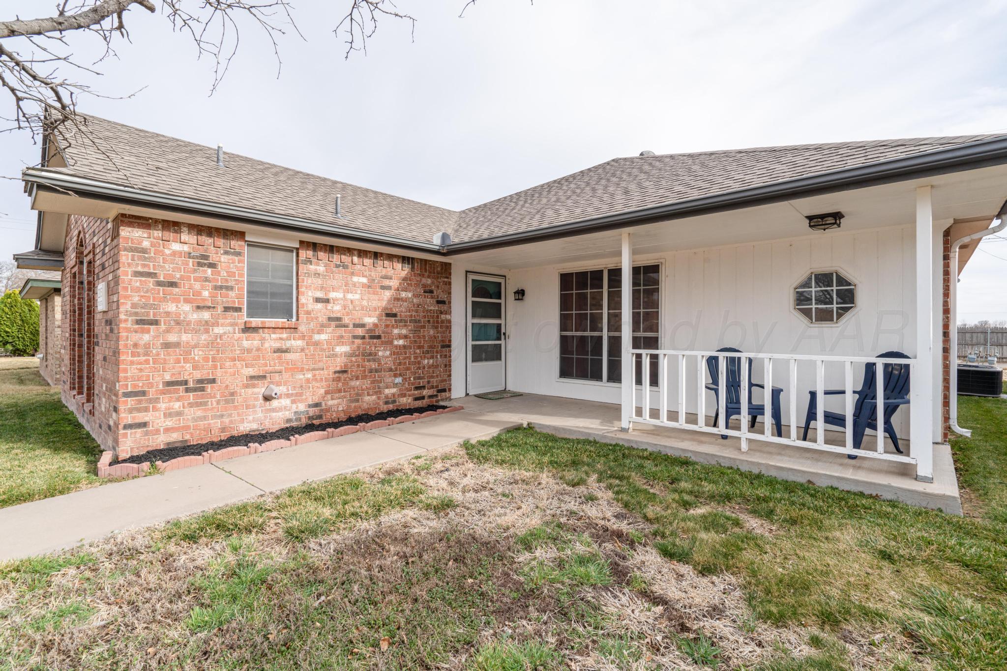 2205 Troveta Drive Amarillo, TX 79110 - Photo 27 of 28 a view of front door and potted plants