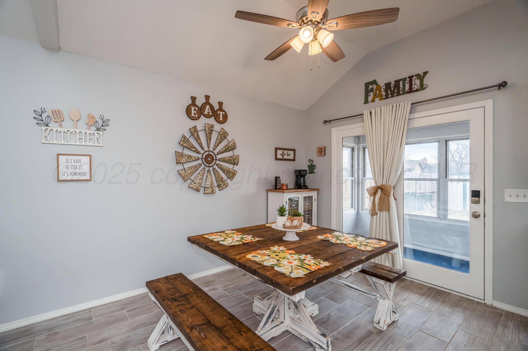 2205 Troveta Drive Amarillo, TX 79110 - Photo 4 of 28 a bedroom with a bed and a chandelier