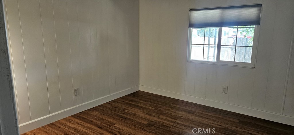 2920 Clark Road, Unit C12 Oroville, CA 95965 - Photo 11 of 17 an empty room with wooden floor and windows