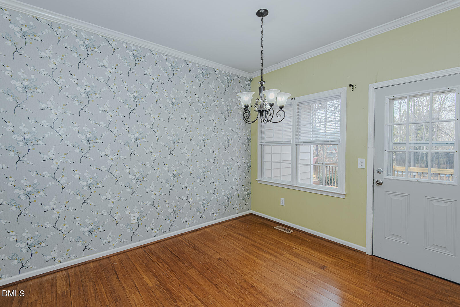 802 South Third Street Mebane, NC 27302 - Photo 11 of 41 a view of empty room with wooden floor and fan