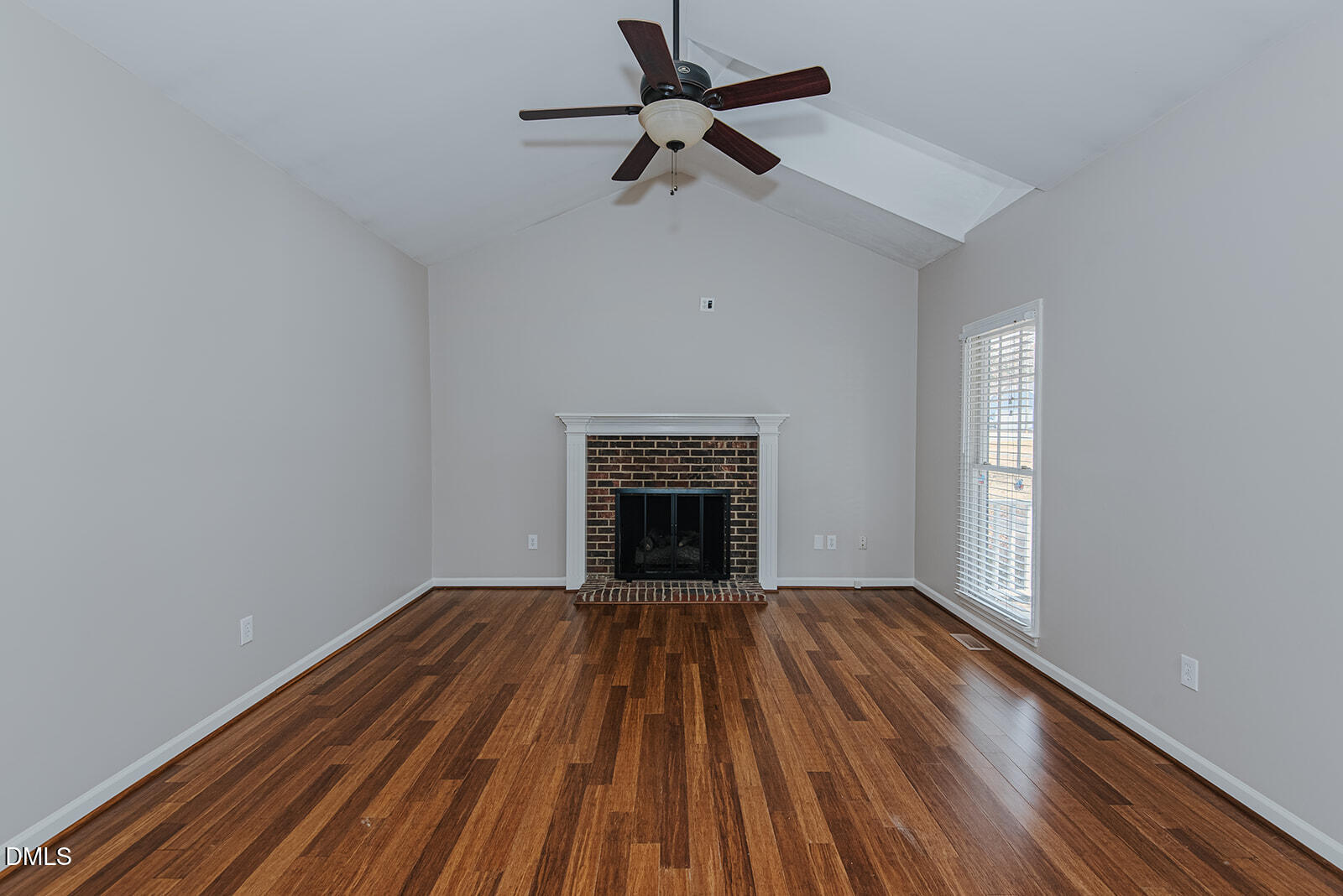 802 South Third Street Mebane, NC 27302 - Photo 13 of 41 a view of an empty room with wooden floor fireplace and a window