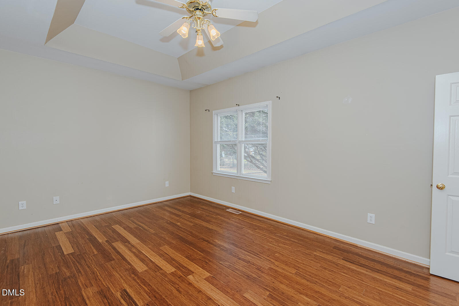 802 South Third Street Mebane, NC 27302 - Photo 19 of 41 a view of an empty room with wooden floor and a chandelier fan