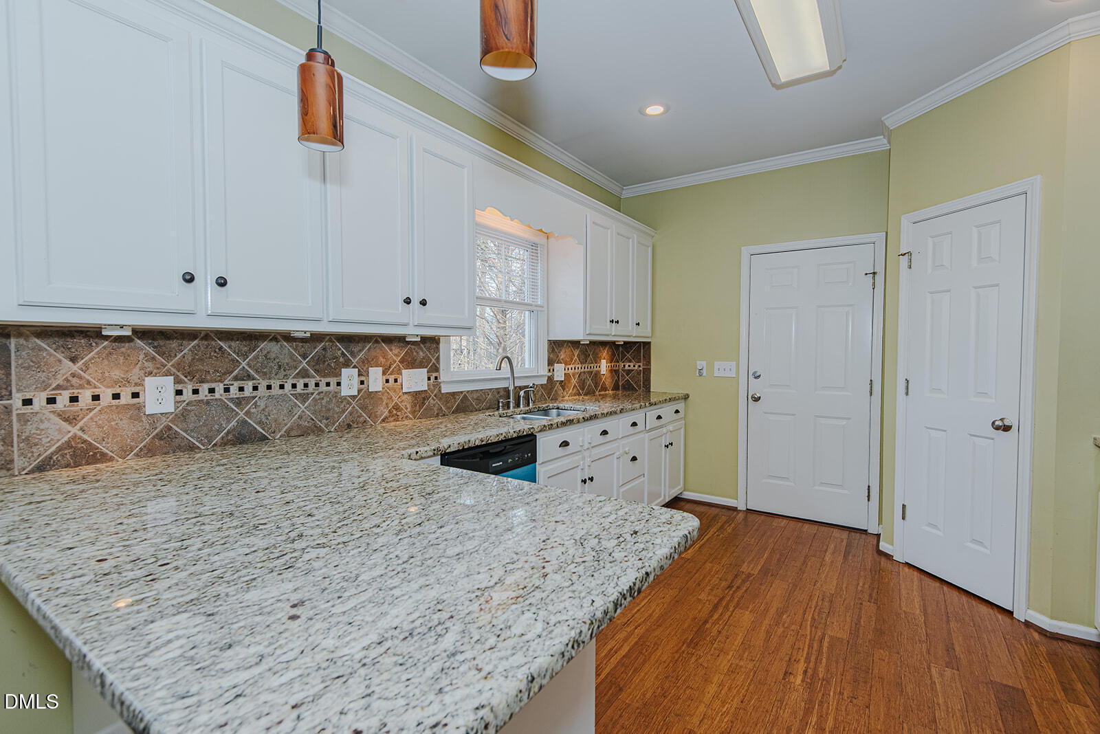 802 South Third Street Mebane, NC 27302 - Photo 5 of 41 a view of a kitchen with wooden floor