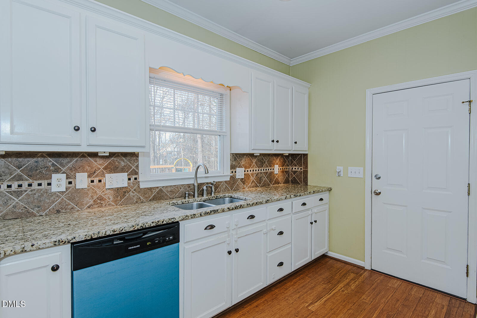 802 South Third Street Mebane, NC 27302 - Photo 6 of 41 a kitchen with granite countertop white cabinets and a stove