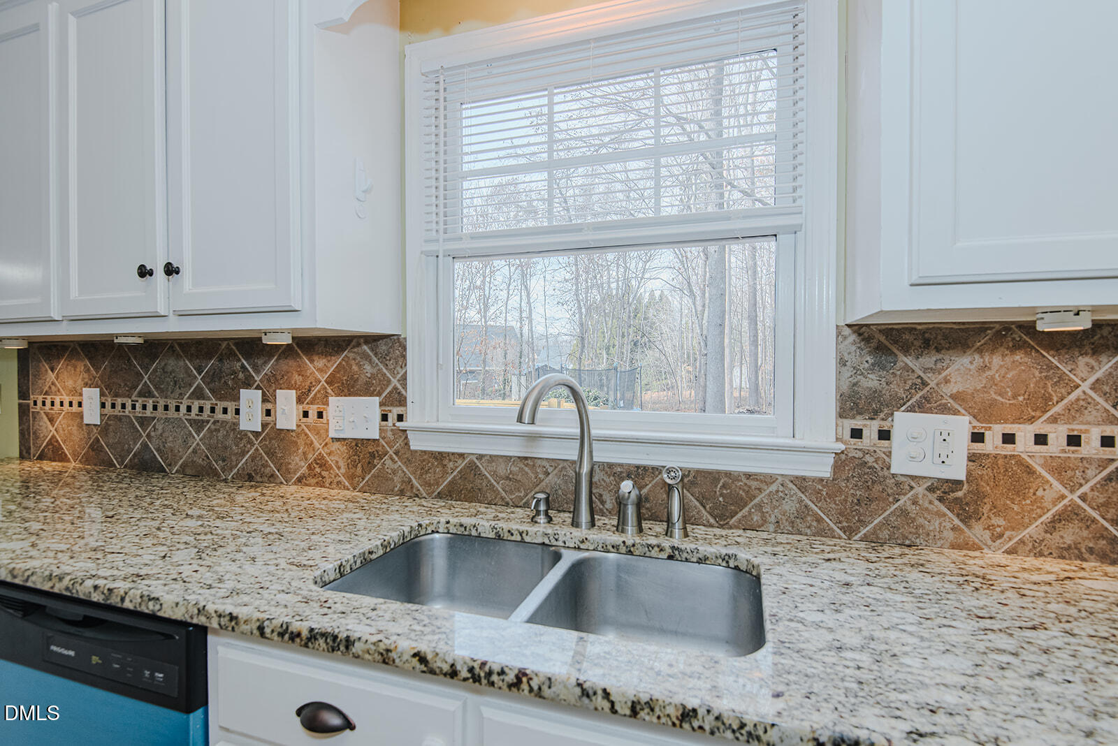 802 South Third Street Mebane, NC 27302 - Photo 7 of 41 a kitchen with granite countertop a sink window and cabinets