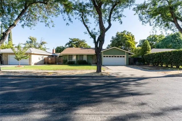 a view of house with outdoor space and swimming pool