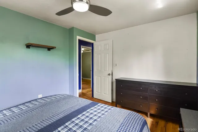 a bedroom with a bed and a dresser