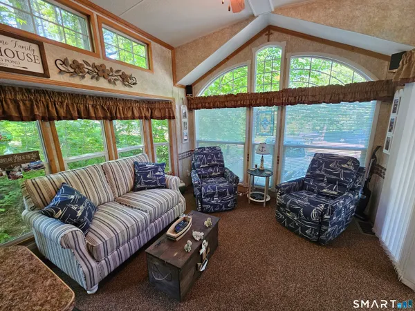 a living room with furniture and windows
