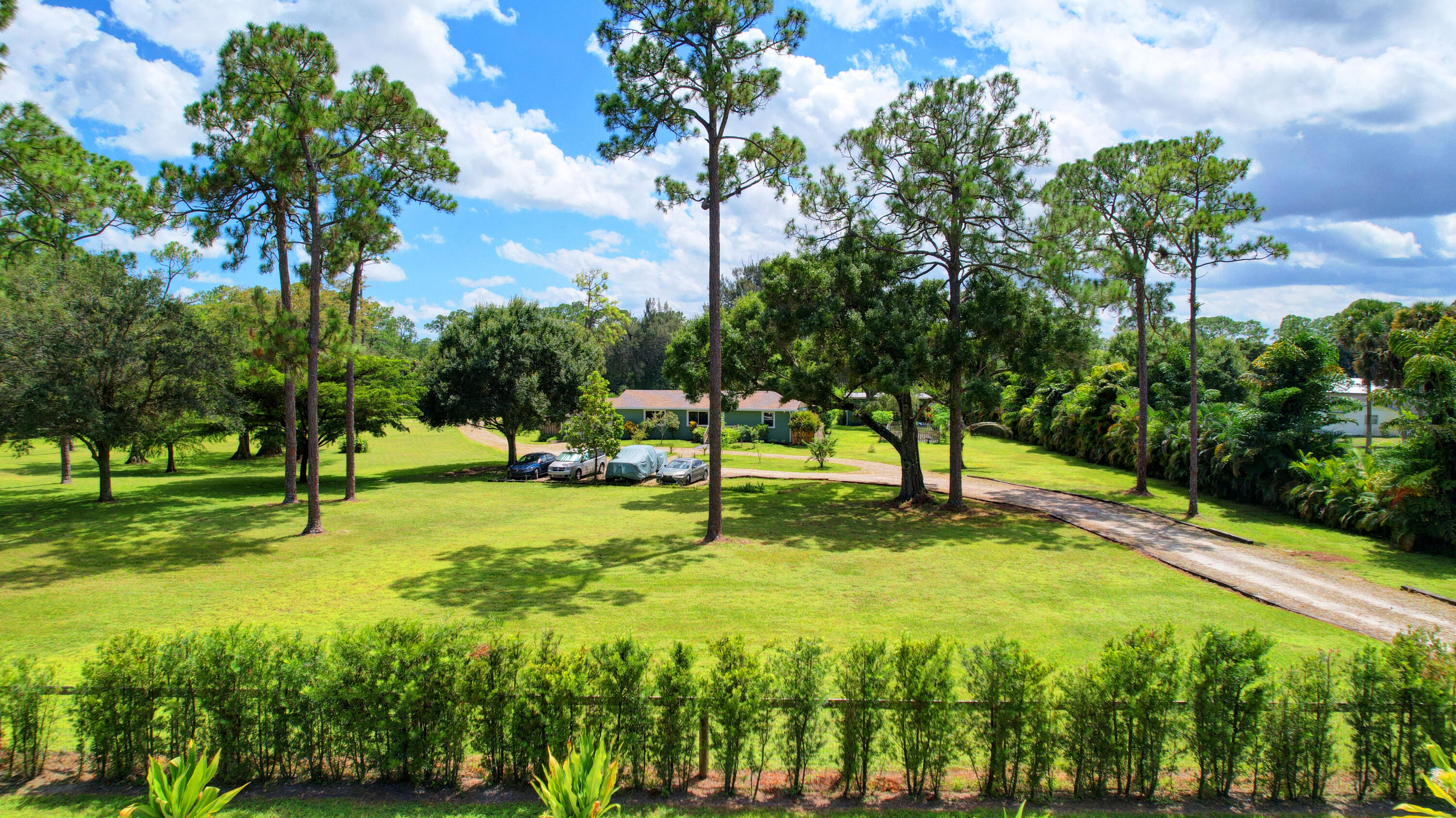 13598 N Road Loxahatchee Groves, FL 33470 - Photo 2 of 87 01_house air (1)