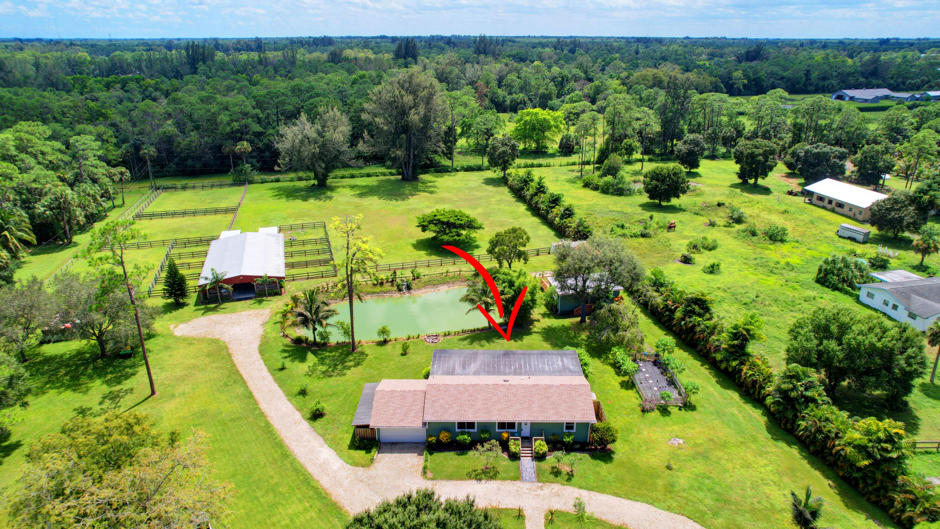 13598 N Road Loxahatchee Groves, FL 33470 - Photo 4 of 87 04_house air (4)
