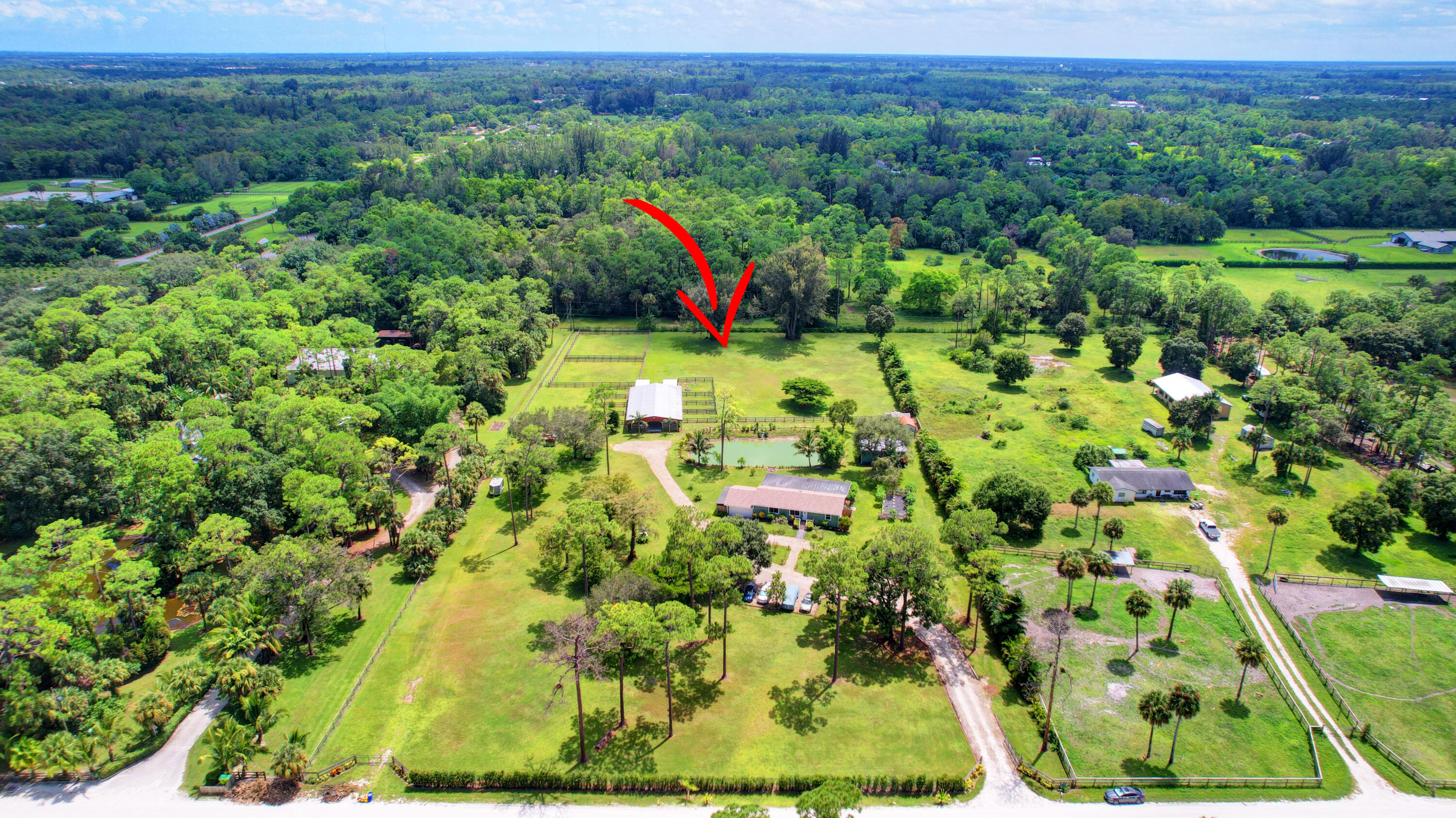 13598 N Road Loxahatchee Groves, FL 33470 - Photo 5 of 87 05_house air (5)