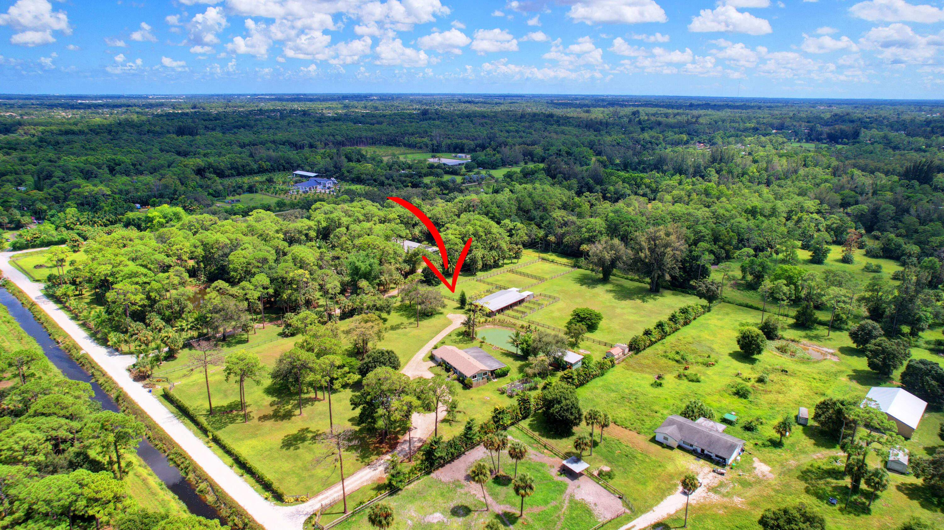 13598 N Road Loxahatchee Groves, FL 33470 - Photo 6 of 87 06_house air (6)