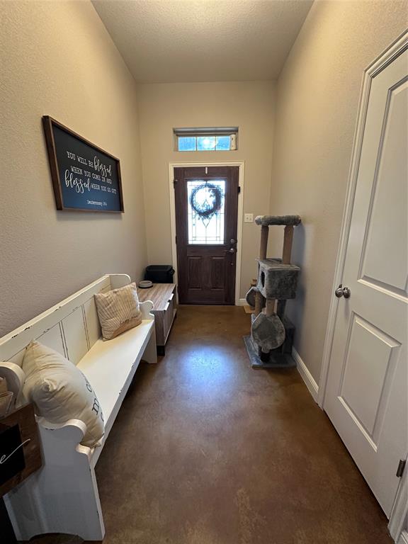 1212 Bowman Ridge Road Stephenville, TX 76401 - Photo 13 of 23 a living room with furniture and a gate